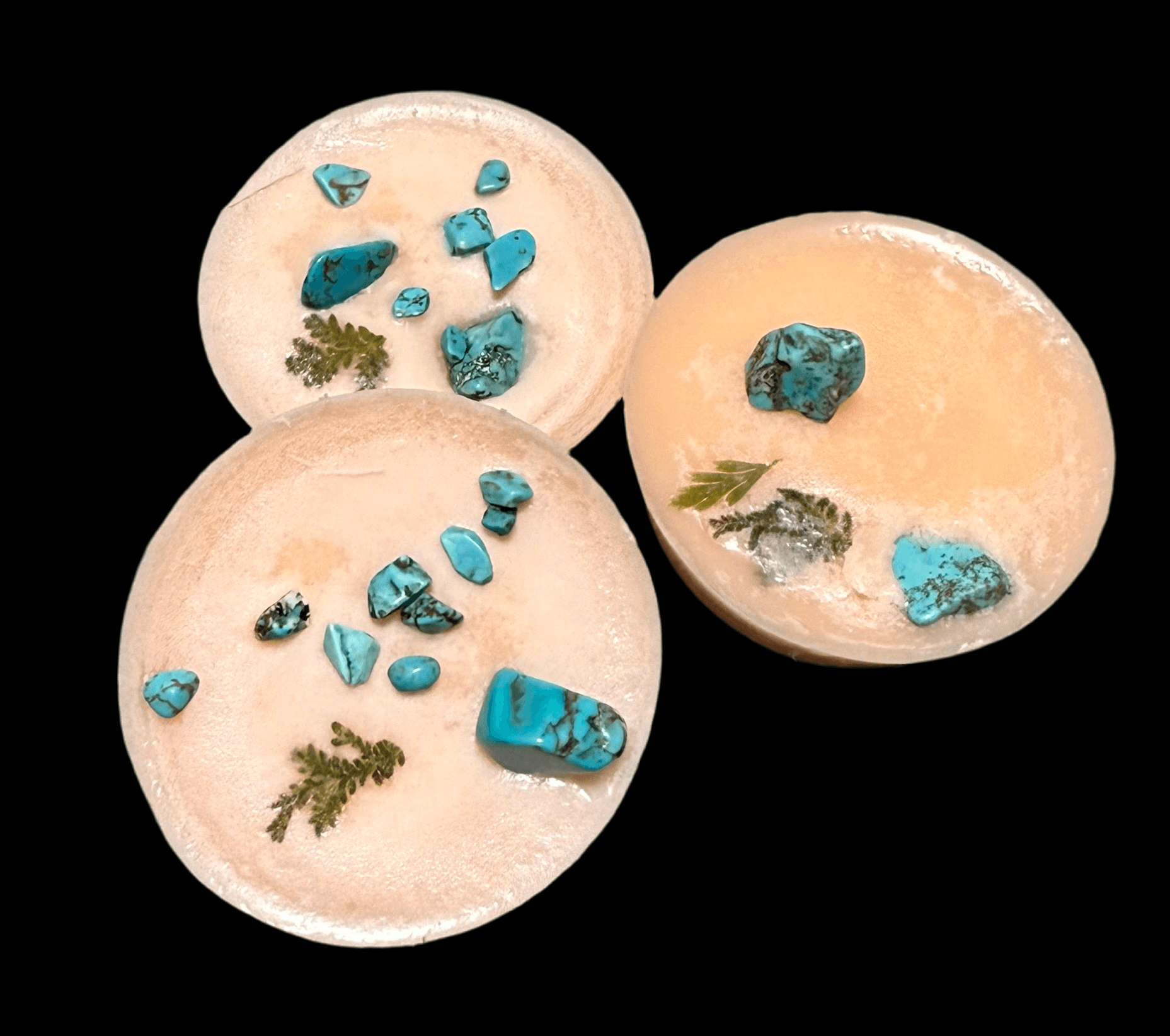 Handmade Blood Orange scented wax melts with turquoise crystals and dried herbs, perfect for creativity and self-care.