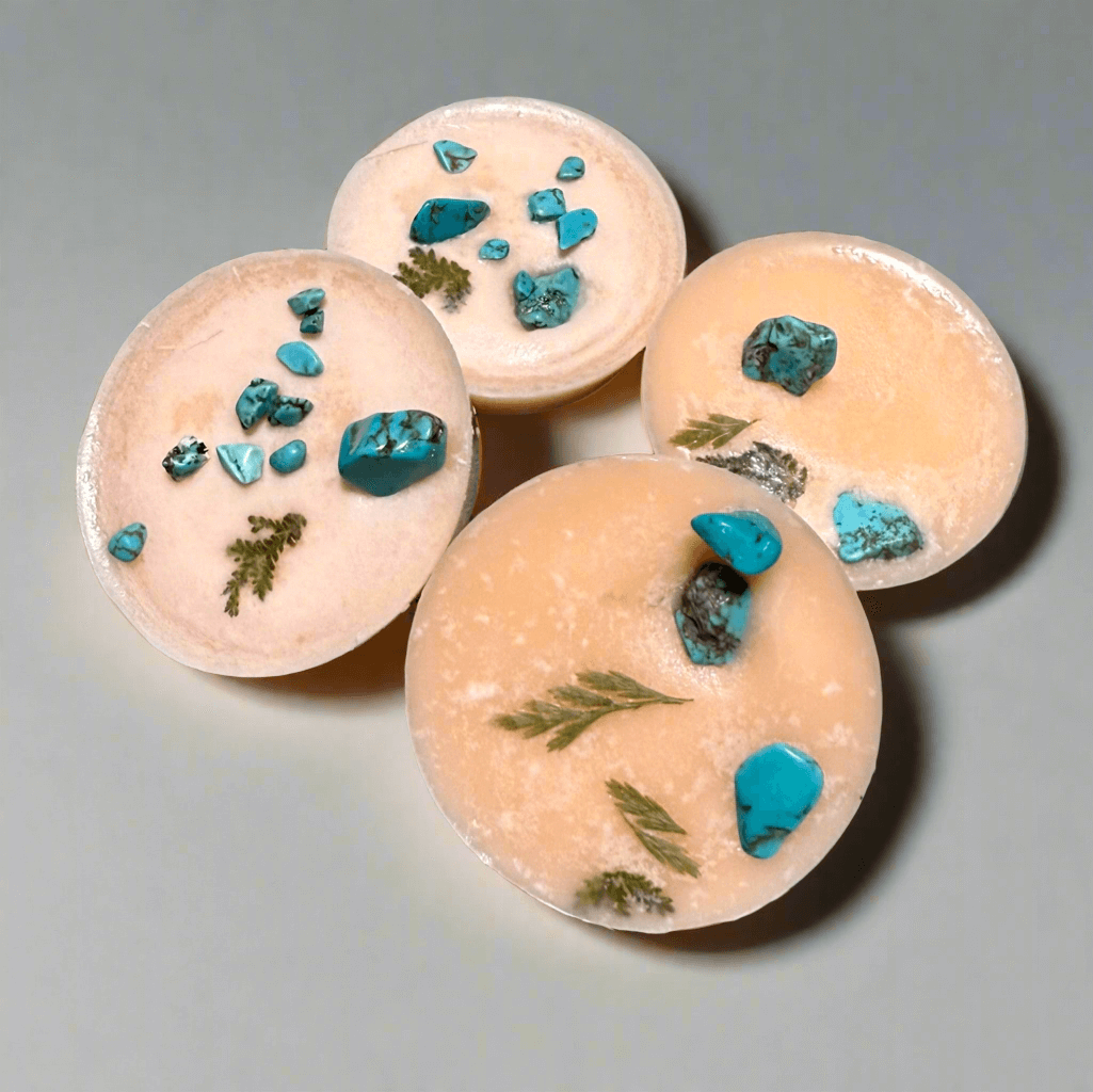 Handmade blood orange scented wax melts infused with turquoise crystals, perfect for self-care and creativity.