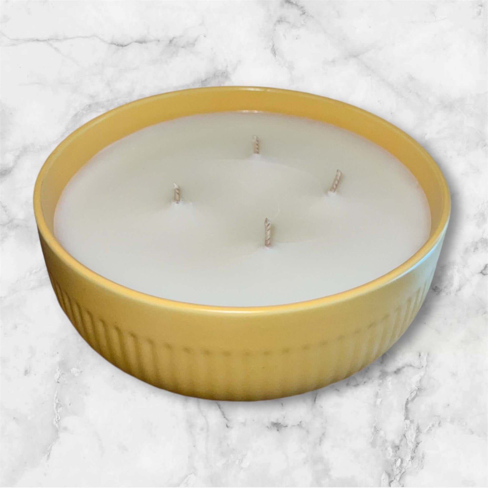 Large 4 wick Lemon Poundcake candle in yellow ceramic retro dish.